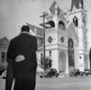 Shadow of a Doubt (1943) - on location - Publicity photograph for ''Shadow of a Doubt'' of Thornton Wilder (obscured) and Hitchcock looking at the Methodist Episcopal Church South, Santa Rosa.