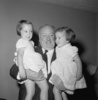The Hitchcock Family (1956) - Photograph of Alfred Hitchcock and his granddaughters Mary Alma (L) and Teresa (R), taken in August 1956.