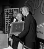 Screen Producers Guild (1965) - Hitchcock accepts the Screen Producers Guild Milestone Award from James Stewart and Cary Grant at an awards ceremony held on 7th March 1965.
