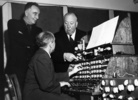 The Birds (1963) - publicity still - Photograph of Hitchcock with composers Remi Gassmann and Oskar Sala, working on their modified trautonium to produce the electronic soundtrack of ''The Birds'' (1963).