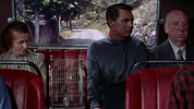 To Catch a Thief (1955) - film frame - Film frame from ''To Catch a Thief'' (1955) showing Hitchcock's cameo appearance alongside Cary Grant.