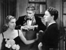 Rebecca (1940) - photograph - Photograph of Joan Fontaine, Judith Anderson, and Laurence Olivier in ''Rebecca''.