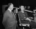 The Man Who Knew Too Much (1956) - on set - On set photograph of James Stewart and Hitchcock, taken during the filming of ''The Man Who Knew Too Much'' (1956).