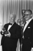 Alfred Hitchcock (1968) - Photograph of Hitchcock accepting the Thalberg Award from director Robert Wise at the 1968 Academy Awards, taken by Bud Gray.