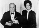 Alfred Hitchcock (1972) - Alfred Hitchcock receives the 1972 Cecil B. DeMille Award from actress Rosalind Russell.