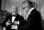 Alfred Hitchcock (1968) - Photograph of Hitchcock accepting the Thalberg Award from director Robert Wise at the 1968 Academy Awards.