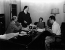 Photograph taken during a script conference for ''Lifeboat'' (1944). L-R: Kenneth Macgowan, Alfred Hitchcock, Alma Reville & Jo Swerling.
