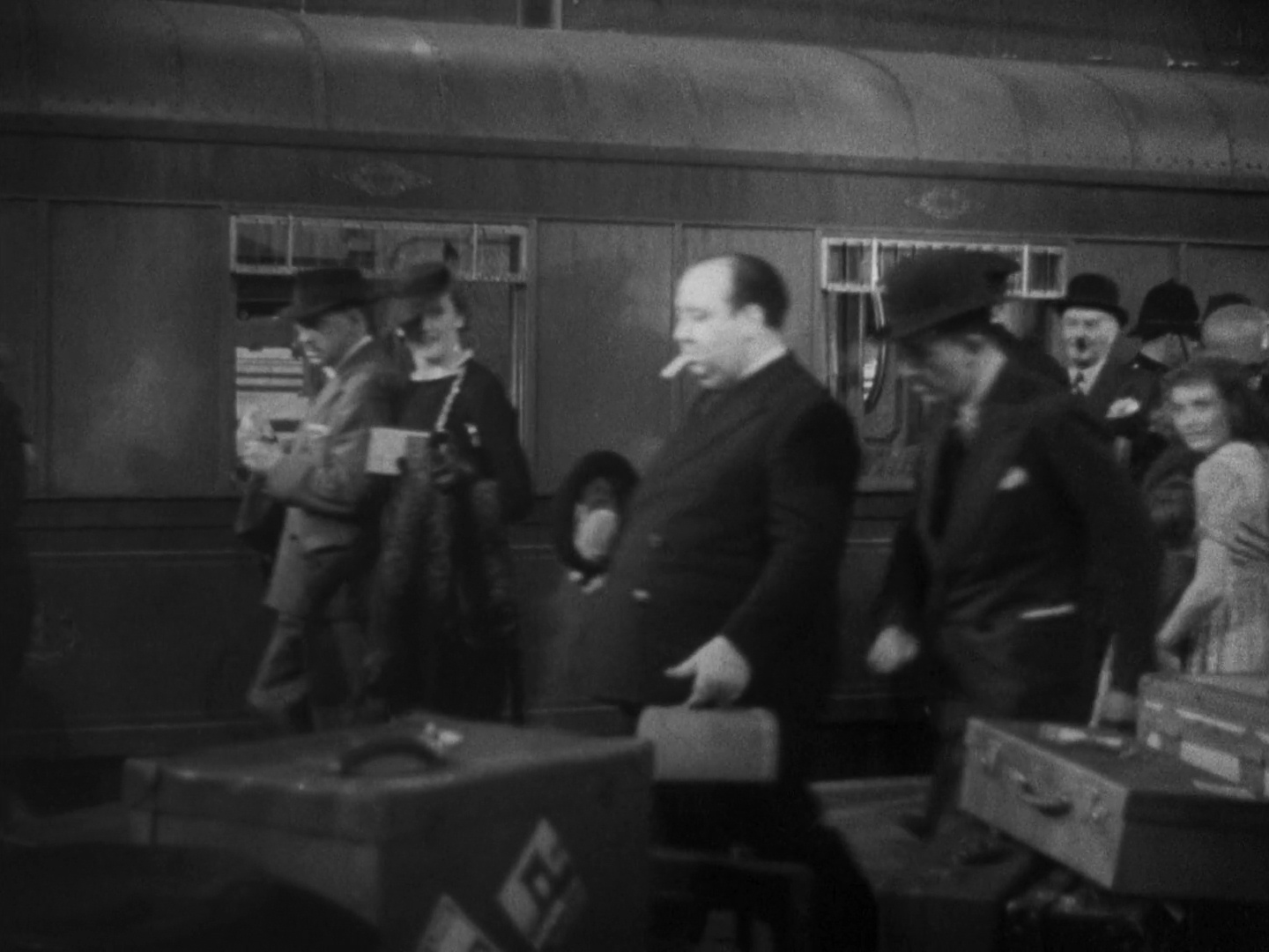 The Lady Vanishes (1939) - Hitchcock's cameo - The Alfred Hitchcock Wiki